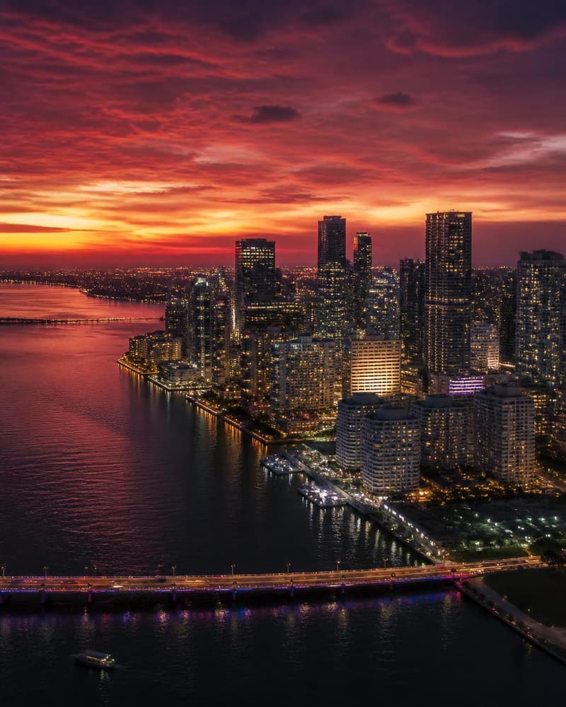 Aerial view of the Miami Brickell skyline over Biscayne Bay at twilight